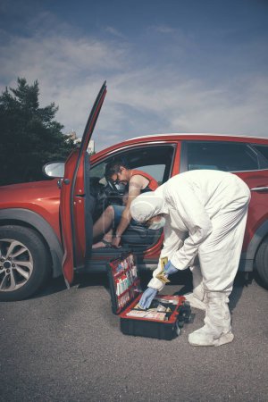 Photo for Crime scene investigation - investigation and collecting of evidences in car with dead man - Royalty Free Image