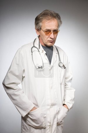 Photo for Doctor practicioner in traditional retro medical gown isolated on background - Royalty Free Image