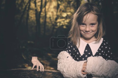 Photo for Young girl in halloween style posing in autumn forest - Royalty Free Image