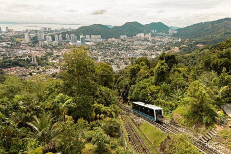 Funicular going to the top station in Penang Hill with George Town aerial view, Malaysia
