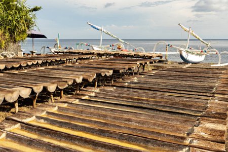 Téléchargez les photos : Wooden trays for the sea salt production in Amed, Bali - en image libre de droit