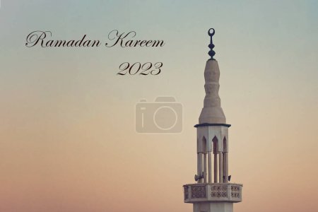 Téléchargez les photos : Mosque Minaret against sunset sky Ramadan Kareem Greetings - en image libre de droit
