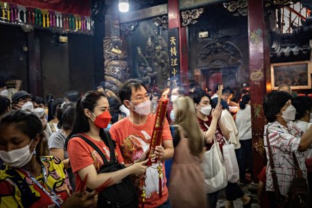 Photo for Chinese temple people praying in Chinatown Bangkok - Royalty Free Image