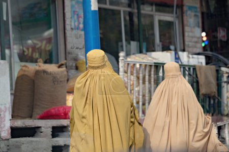 Photo for Pakistani women coweres with burqa on the street of Peshawar Pakistan - Royalty Free Image