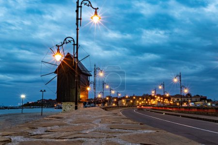 Photo for Old windmill at the entrance to Nessebar old town at sunset, Unesco Heritage site, Bulgaria - Royalty Free Image