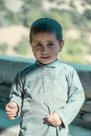 Photo for Pakistani kid portrait from Kalash village near their house Pakistan - Royalty Free Image
