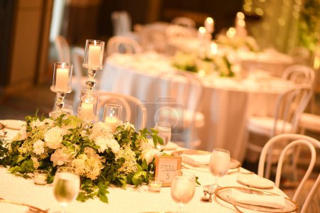 Photo for Closer view of floral wedding table decorations - Royalty Free Image