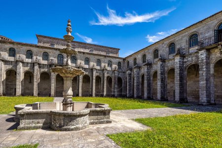 Photo for Courtyard of the monastery of Oseira at Ourense, Galicia, Spain. Monasterio de Santa Maria la Real de Oseira. Trappist monastery. Arched buildings and fountain. - Royalty Free Image
