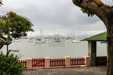 Photo for Seascape with yachts on the calm sea at Santo Antonio de Lisboa, Florianopolis in Brazil - Royalty Free Image