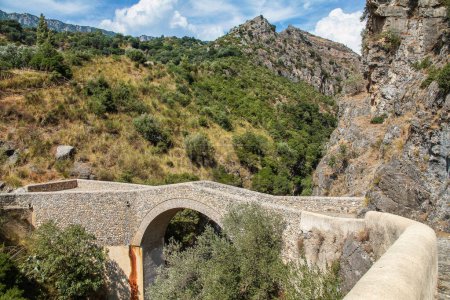 Raganello Gorge with Devil bridge in Civita, Calabria in Italy. Beautiful mountain landscape of the Pollino National Park in South Italy of regions Calabria and Basilicata