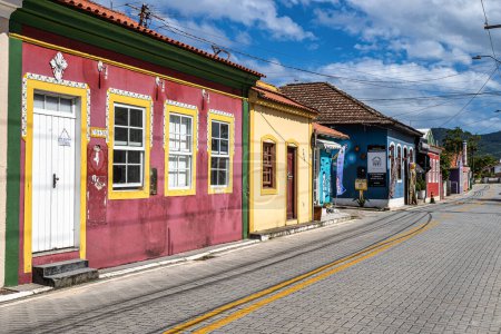 Photo for Old colorful houses in colonial Portuguese architecture in Ribeirao da Ilha, Florianopolis, Santa Catarina, Brazil. - Royalty Free Image