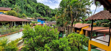 Photo for Ilha Grande, Brazil - Jan 28, 2024: Vila do Abraao town at Ilha Grande island with beautiful houses and gardens. Located near Rio de Janeiro, Brazil it is a perfect getaway from busy city life. - Royalty Free Image