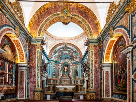 Photo for Interior of the Chapel of Saint Sebastian, Ermida de Sao Sebastiao at Tavira, Algarve, Portugal. Medieval origin and rebuilt in 1745 in Baroque style - Royalty Free Image
