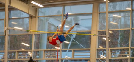 Photo for Pole vault athlete in an athletics gym - Royalty Free Image