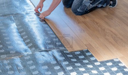 Laying laminate on a floor in an apartment