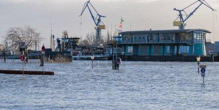 Photo for Storm surge and Elbe flood at the Port of Hamburg St. Pauli fish market Fish auction hall - Royalty Free Image
