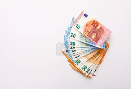 Foto de Euro money banknotes on a light background close up. - Imagen libre de derechos