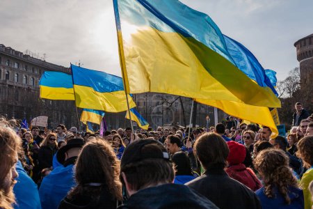 Photo for MILAN, ITALY - FEBRUARY 25, 2023: One year after Russia-Ukraine war, 1st anniversary. Rally of the population in support of Ukraine in Milan, Castello Sforzesco. - Royalty Free Image