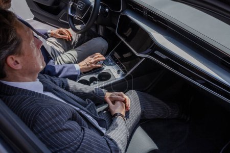 Photo for MILAN, ITALY - APRIL 16 2018: Audi city Lab. Two people test the interior of the new Audi - Royalty Free Image