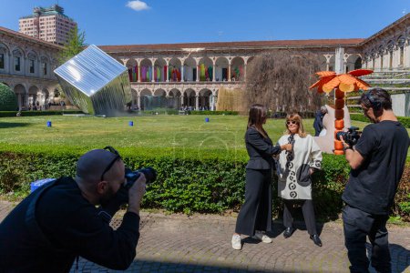 Photo for MILAN, ITALY - 17 APRIL 2023: interview with Gilda Bojardi, director of Interni magazine, during the Fuorisalone in the garden of the state university during design week - Royalty Free Image