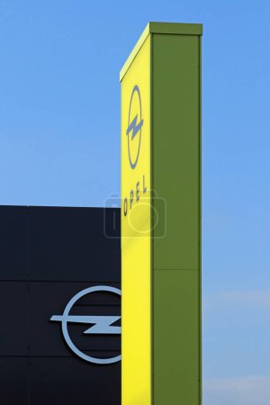Photo for Italy, year 2023, illuminated street signs of an Opel dealer, a European automotive industry brand - Royalty Free Image