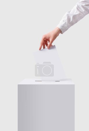 The voter throws the ballot into the ballot box. The concept of democracy. Voting concept.