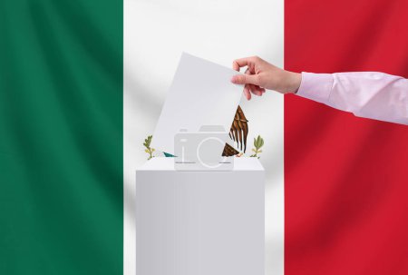 Elections, Mexico. Election concept. The voter throws the ballot into the box.