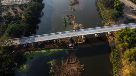 Photo for Aerial view of renovation and repair work on the river bridge road. - Royalty Free Image