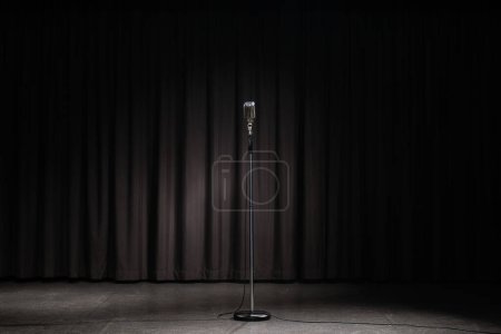 Photo for Retro style microphone on dark background - Royalty Free Image