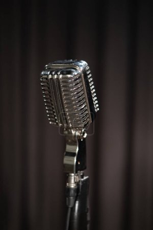 Photo for Retro style microphone on dark background - Royalty Free Image