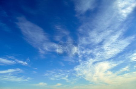White clouds on the background of the blue sky