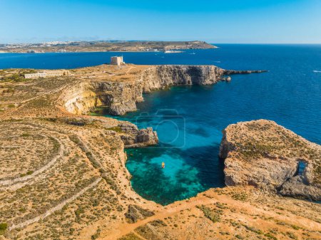Drone view of Tower on Comino island and Crystal lagoon. Maltese island