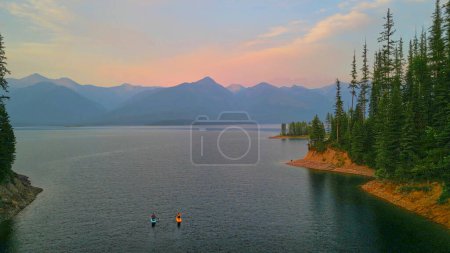 Aerial view of two paddleboarders on Hungry Horse Reservoir, MT.