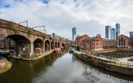 Photo for A multi image panorama overlooking the Bridgewater Canal in Manchester and featuring the Beetham Tower and Deansgate Square skyscraper complex in February 2023. - Royalty Free Image