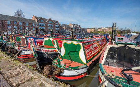 Photo for Colours of the Ellesmere Port Easter boat gathering featuring sixty narrow boats in April 2023 on the Ellesmere Canal. - Royalty Free Image