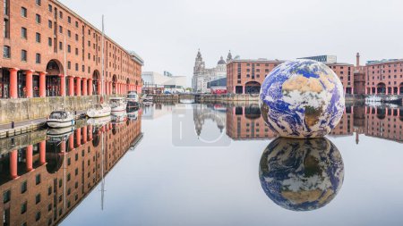 Photo for A multi image panorama of the Floating Earth sculpture in the Royal Albert Dock in Liverpool captured in May 2023 as part of hosting the Eurovision Song Content. - Royalty Free Image