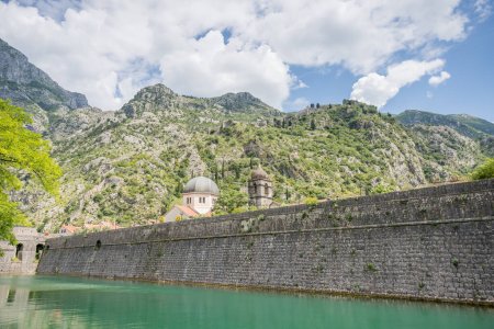 Water meets the medieval Valier Bastion in Kotor, Montenegro seen on a bright day in May 2023.