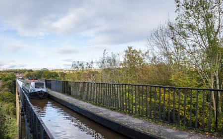 Photo for A multi image panorama of a narrow boat passing over the Pontcysyllte Aqueduct in Wales seen on 21 October 2023. - Royalty Free Image