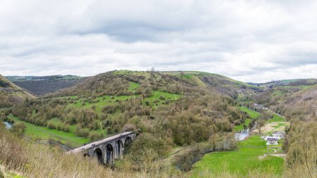 A multi image panorama of the Monsal Head Bridge pictured from the road side looking down on the Monsal Trail and Monsal Dale.