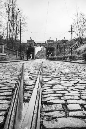 Photo for Tramlines through the cobblestones seen at the National Tramway Museum near Matlock, Derbyshire in April 2024. - Royalty Free Image