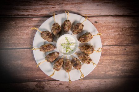 Foto de Recipe of kefta, beef skewer, Traditional homemade, with Greek yoghurt sauce, garlic, savory, Arabic and Libanese food, High quality photo - Imagen libre de derechos