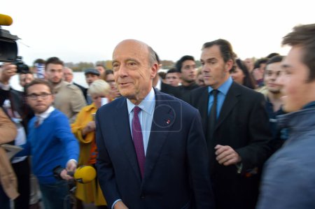 Photo for BORDEAUX, FRANCE - 22 NOVEMBER 2014 : Alain Juppe, mayor of the city of Bordeaux walking on the quays of the Garonne. High quality photo - Royalty Free Image