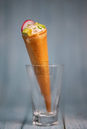 Photo for Brick cone with tuna sauce, mayonnaise, avocado and radish slice, High quality photo - Royalty Free Image