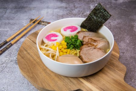 Photo for Fresh ramen noodles with garnish, pork tenderloin, eggs marinated in Mirin and soy sauce, bean sprouts, corn, nori leaf, spring onion, and homemade Narutomaki with codfish back, Hight quality - Royalty Free Image