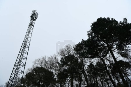 Deployment of the 5G network. Laying antennas on a mobile phone mast in the winter atmosphere. France, Gironde, February 2024. High quality photo