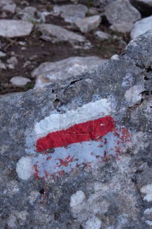 Marking of a long-distance hiking route, white and red, Itineraries in France, Marking on rock, Hiking trail, Pyrenees, High quality photo