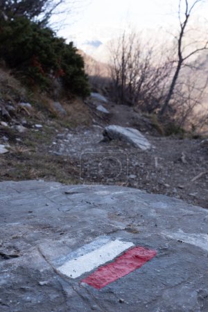 Marking of a long-distance hiking route, white and red, Itineraries in France, Marking on rock, Hiking trail, Pyrenees, High quality photo