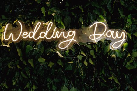 Photo for The inscription Wedding Day on a green background of leaves - Royalty Free Image