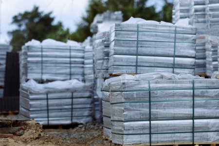 Photo for Pavers are packed in pallets near the construction site. - Royalty Free Image