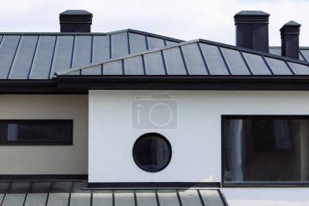 Photo for Many modern white cottages with panoramic windows on the background of the park and blue sky. - Royalty Free Image